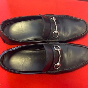 Used pair of black Gucci loafers